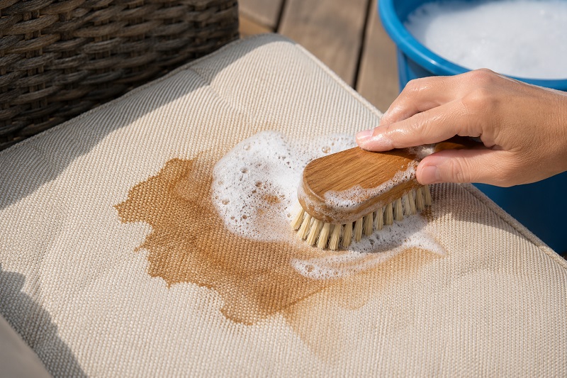 Cleaning a stained cushion indoors